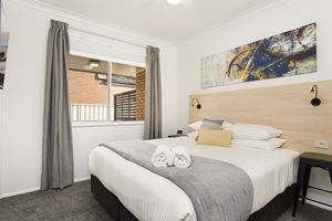 The Main Bedroom at Adamstown Short Stay Apartments.